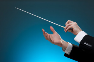 conductor conducting an orchestra
