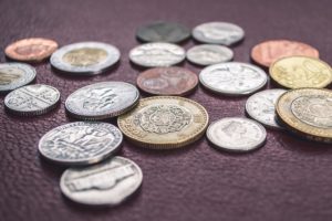 coins on a purple mat