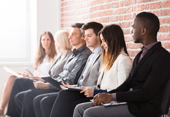 Job candidates queue for an interview