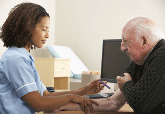 A nurse gives an elderly man an injection