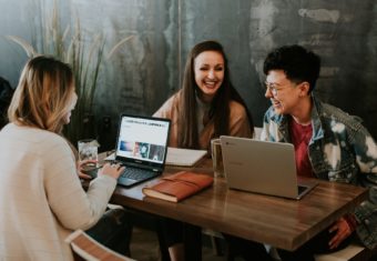 Three coworkers collaborating on a project