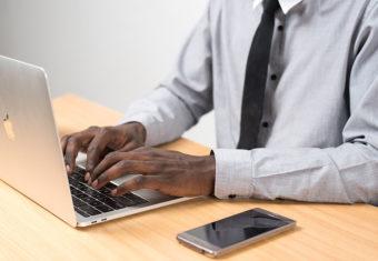 Man typing a resume