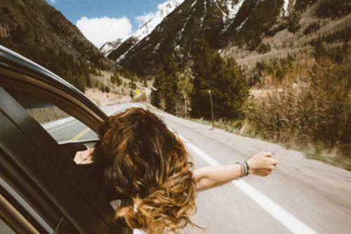 A worker soaks up the sun as they thrive in one of the best travel jobs.
