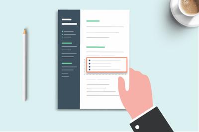 A hand holding a resume highlighting resume bullet points