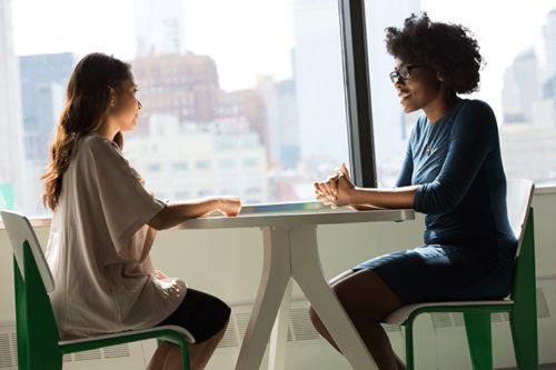 An interviewer asking a candidate to "walk me through your resume"