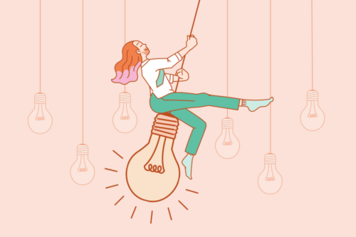 A glamorous man with pink and orange hair and green pants swinging on a lightbulb.